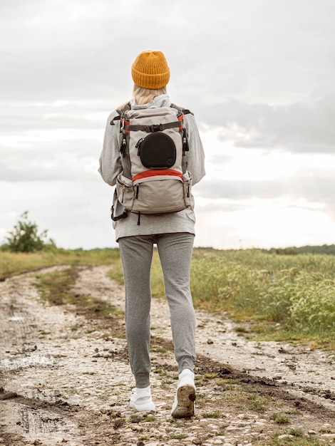 Free photo low angle female with backpack