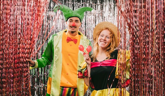 Low angle friends disguised at carnival party