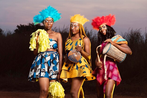 Low angle friends dressed for carnival