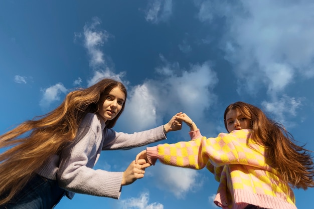 Low angle friends having fun