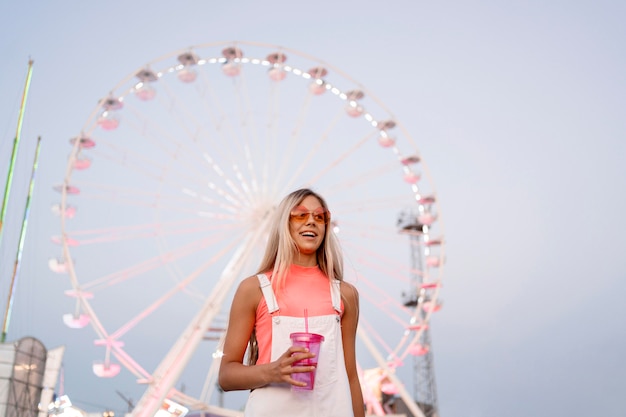 Low angle girl holding drink