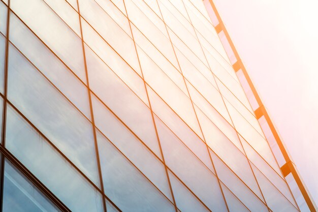 Low angle glass building with sunlight