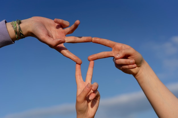 Low angle hand gestures representing friendship