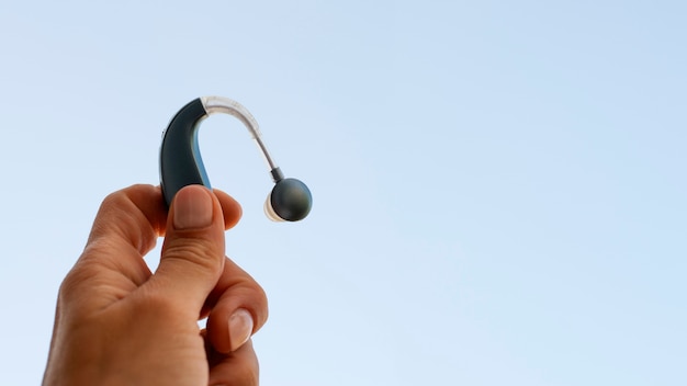 Low angle hand holding hearing aids