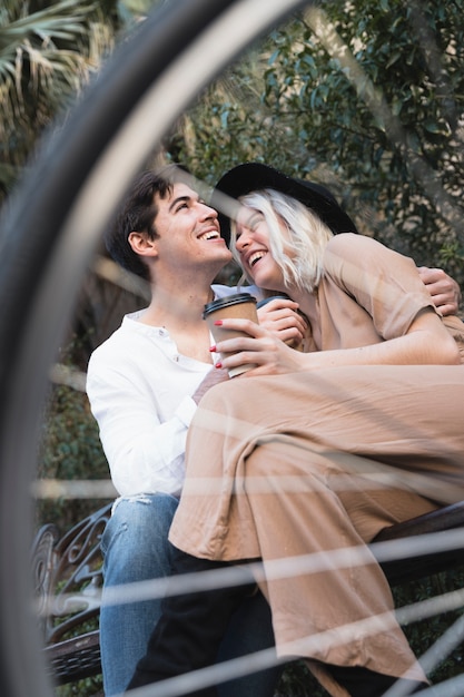 Low angle of happy couple on the bench