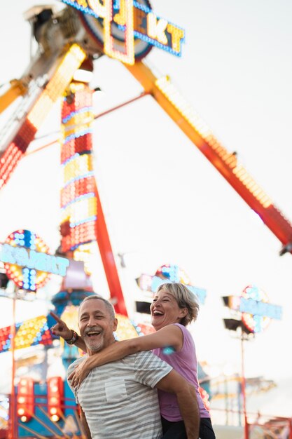 Low angle happy couple having fun 