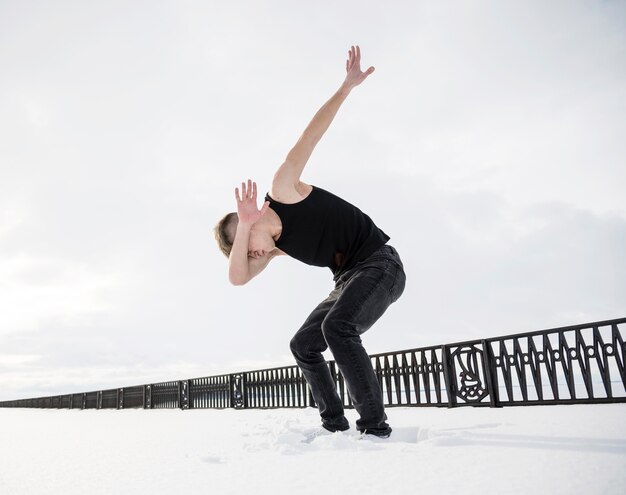 Low angle of hip hop artist dabbing