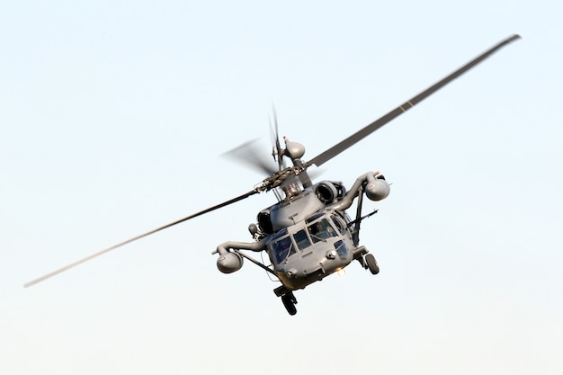 Low angle isolated shot of a military hawk maneuvering