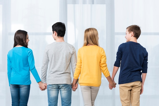 Low angle kids holding hands