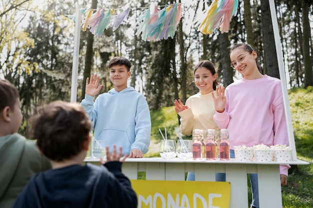 Low angle kids selling lemonade