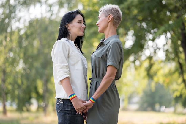 Low angle lesbian couple looking at each other