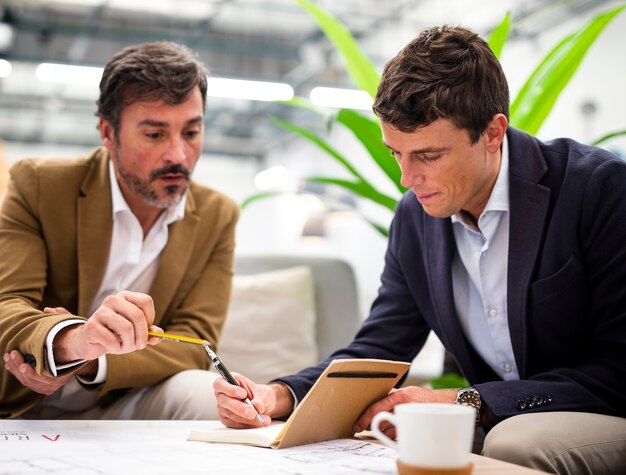 Low angle male coworkers meeting at office