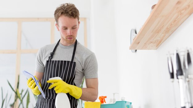 Low angle man cleaning