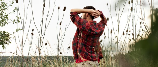 Low angle man in green field