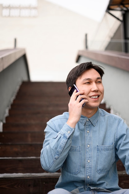 Low angle man talking over phone