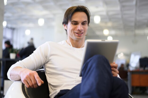 Low angle man using tablet