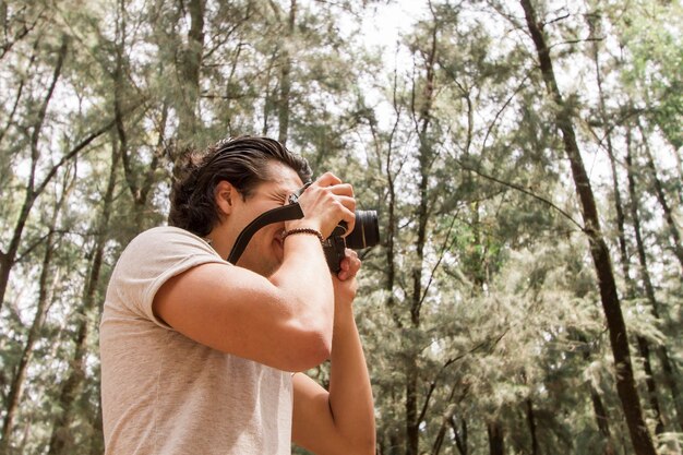 Low angle man with camera