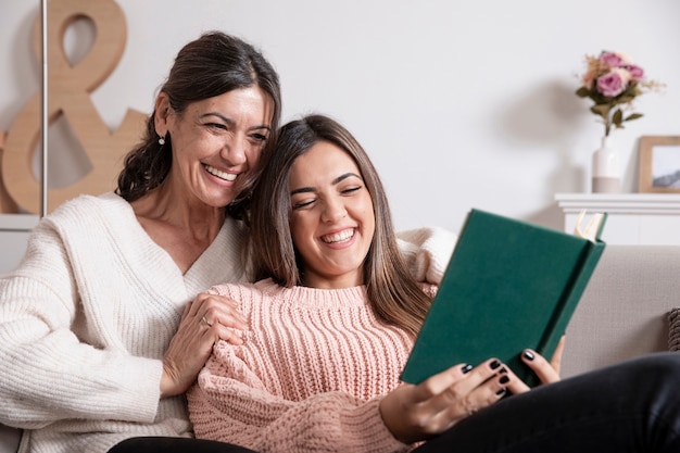 Low angle mother and daughter reading