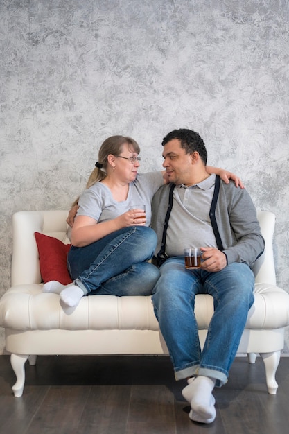 Low angle parents drinking tea