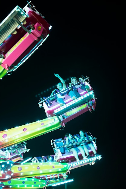 Low angle people in amusement ride 