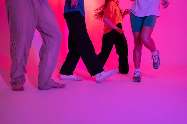 Low angle people dancing in studio