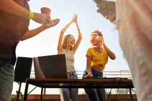 Free photo low angle people partying together