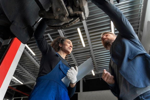 Low angle people talking about car