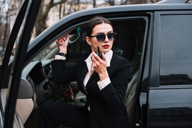 Low angle security female in car