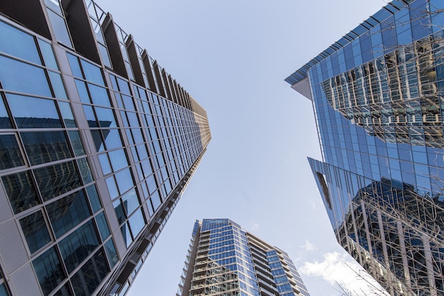 Low angle shot of blue high rise buildings