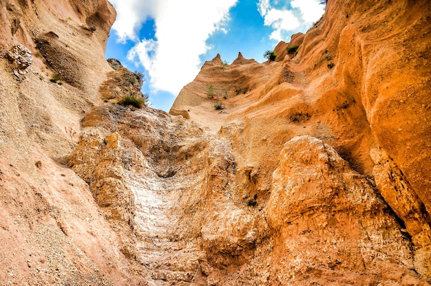 Free photo low angle shot of cliffs under a blue sky in umbria, italy