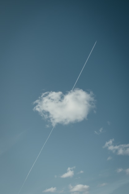 Low angle shot of a cloud with the shape of a cute heart