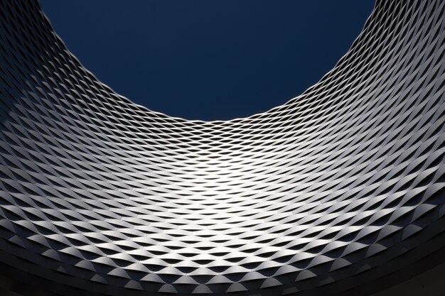 Low angle shot of a curve shape wall with a modern design