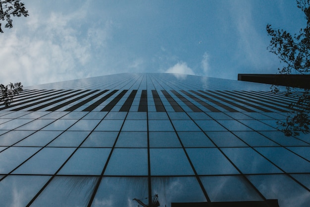 A low angle shot of a tall business building in NYC