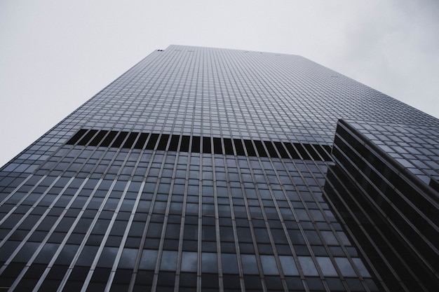 A low angle shot of a tall skyscraper business building in nyc