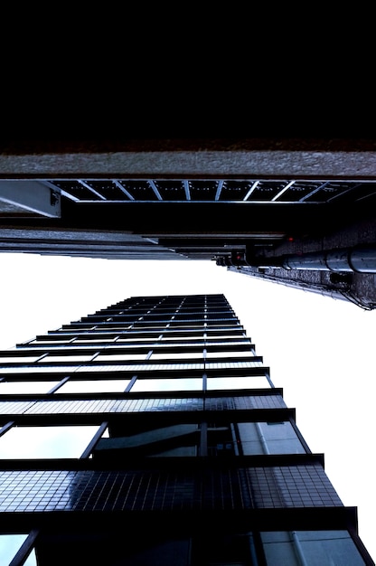 Free photo low angle shot of two large skyscrapers in the city