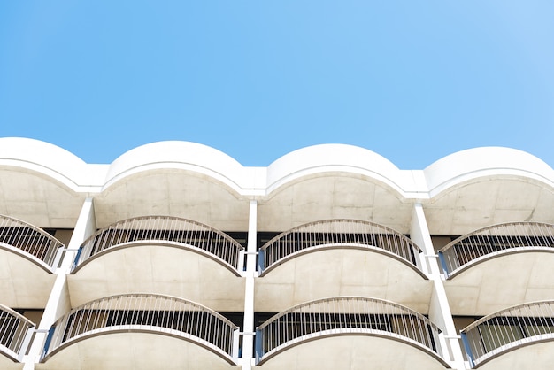 Free photo low angle shot of white architectural building with balconies