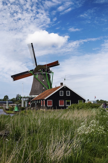 Low angle shot of windmills in Zaanse Schans neighborhood
