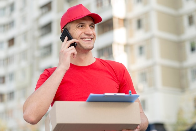 Low angle smiley delivery guy