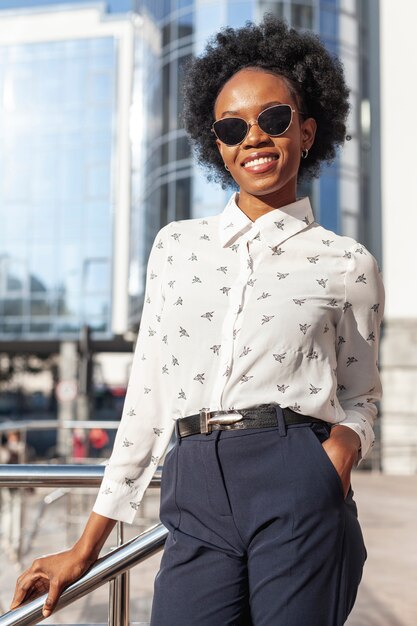 Low angle smiley female on balcony