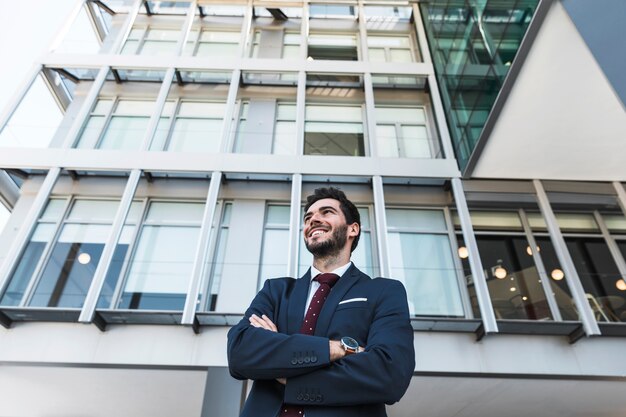 Low angle smiley lawyer with crossed arms