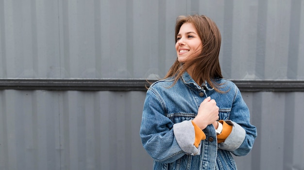 Free photo low angle smiley woman