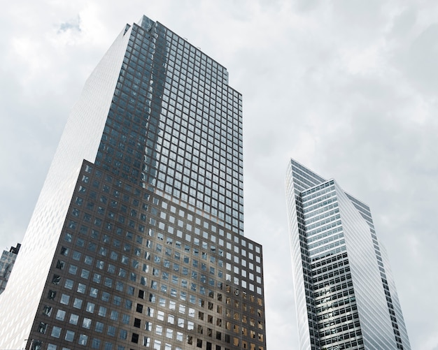 Low angle tall buildings with grey clouds