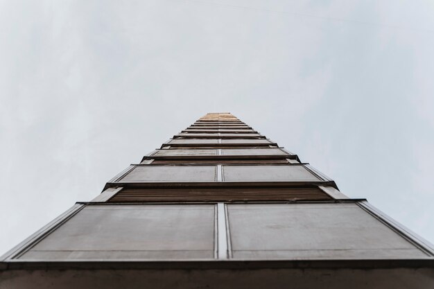 Low angle of tall residential building in the city with copy space