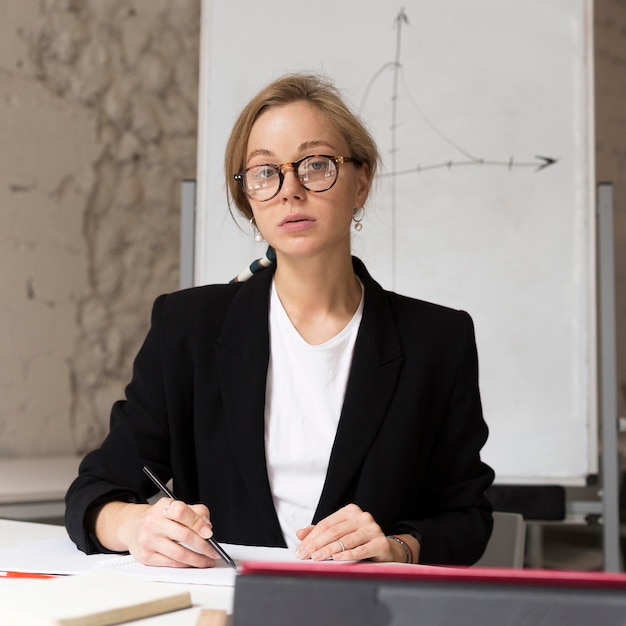 Low angle teacher at desk