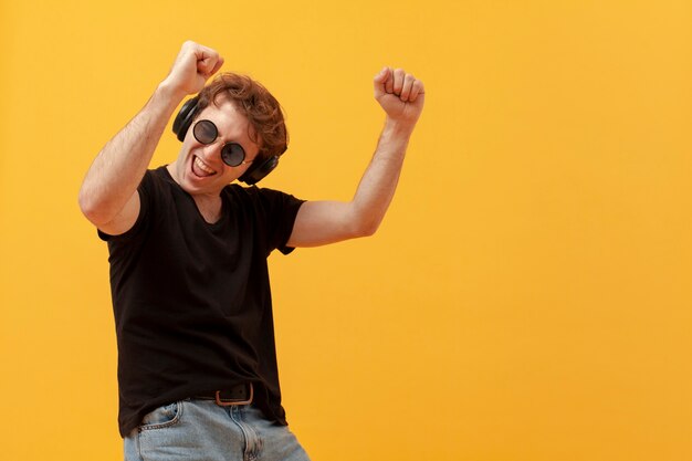 Low angle teenage boy dancing