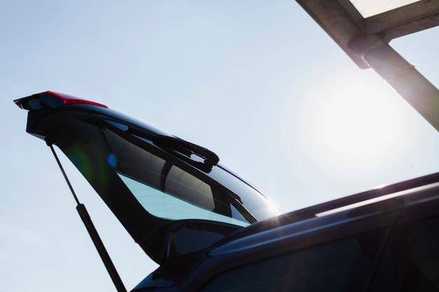 Low angle trunk door of a black car