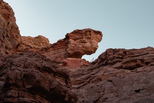 Low angle view of the beautiful rocky cliffs on the desert captured on a sunny day