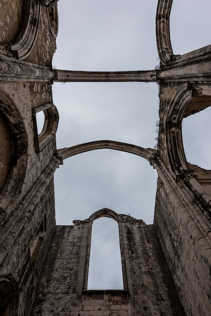 Low angle view of The Convent of Our Lady of Mount Carmel under a cloudy sky in Lisbon in Portugal