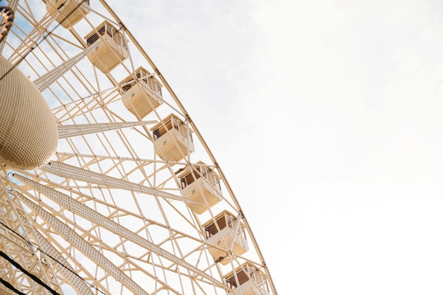 Free photo low angle view of large ferris wheel against clear sky