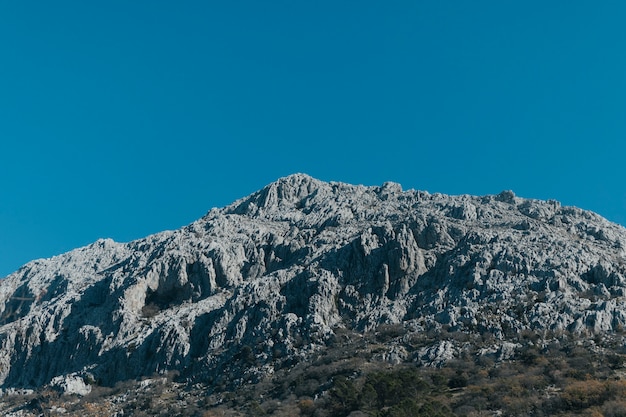 Free photo low angle view stony mountain